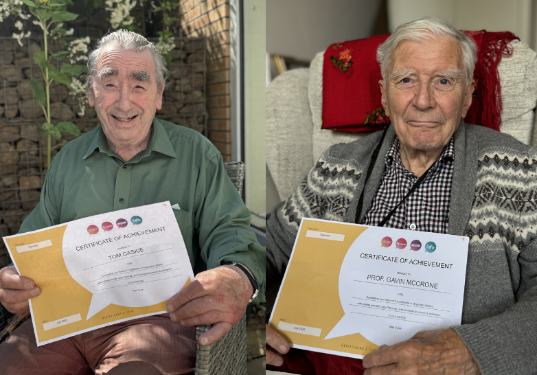 Two care home residents present their certificates for National 2 qualification in (Italian) languages