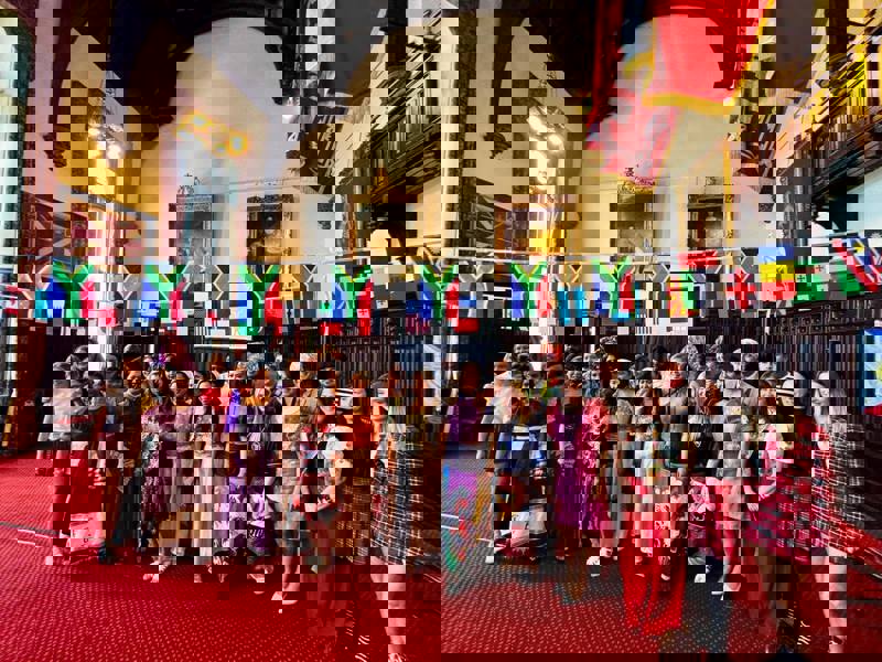 A crowd of people from various Aberdeen care homes gather in their home countries traditional dress in a bid to promote inclusivity and diversity