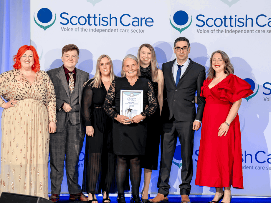 Michelle McManus presents staff from Wyndwell Care Home Peterhead an award for meaningful activity at the Scottish Care awards 2025. 