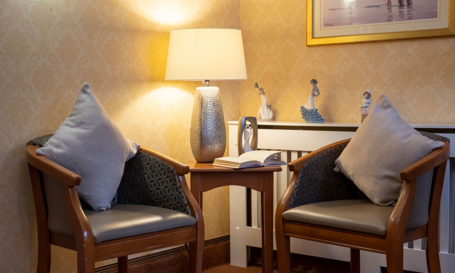 two chairs in a cosy nook, with ambient lighting and decor around