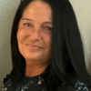 Anna Hoffmann, Care Manager, has long dark hair and a black blouse