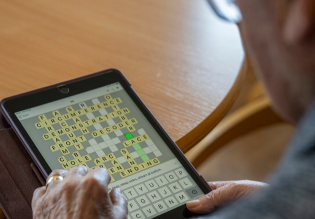 A tablet with a wordsearch on screen