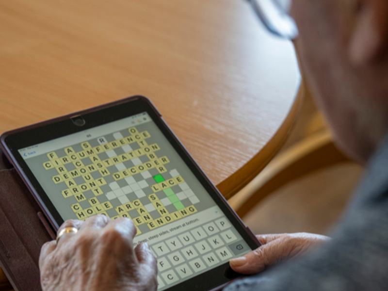 A tablet with a wordsearch on screen