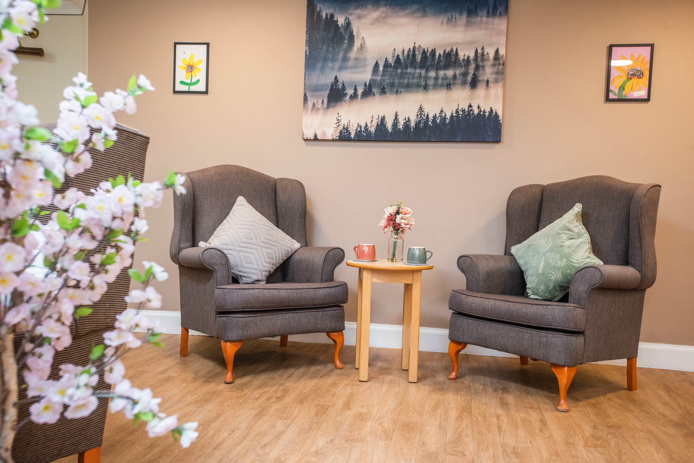 A communal lounge area with seating and artwork
