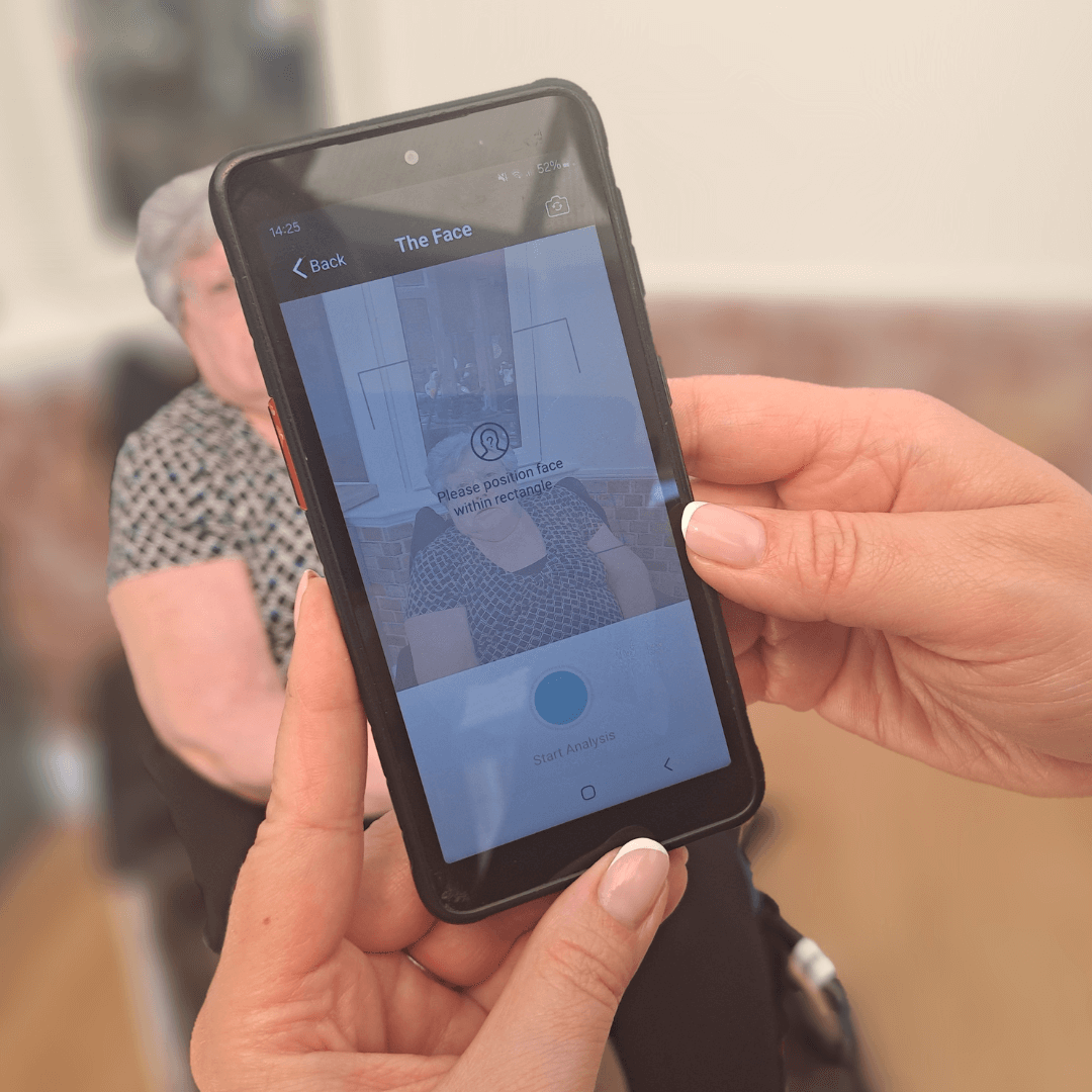 A nourish phone shows a facial analysis on painchek