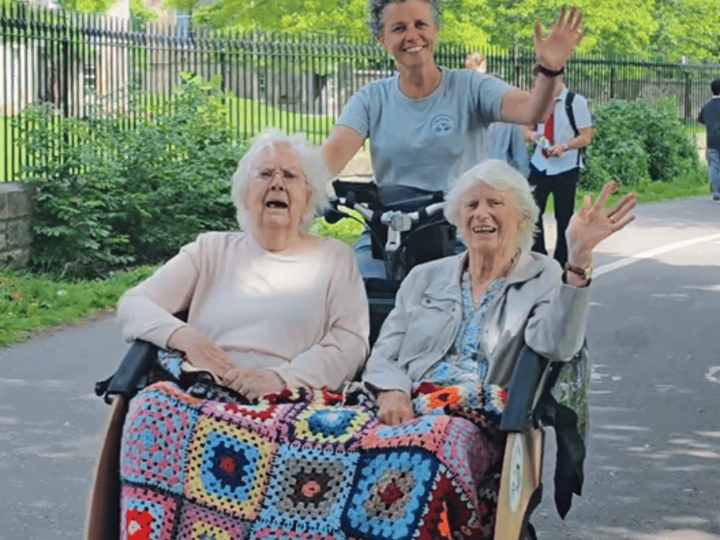 Joyrides owner Lissa takes two residents out for a bike ride in Edinburghs Meadows on her adapted trike 